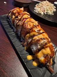 Miya Izakaya signature dishes Tonkotsu Ramen, Pork Belly Buns, Karaage (Japanese fried chicken), various sushi rolls